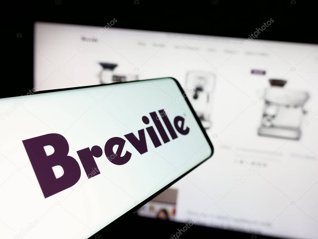 Stuttgart, Germany - 06-12-2025: Smartphone with logo of home appliances company Breville Group Ltd. on screen in front of website. Focus on center-left of phone display.