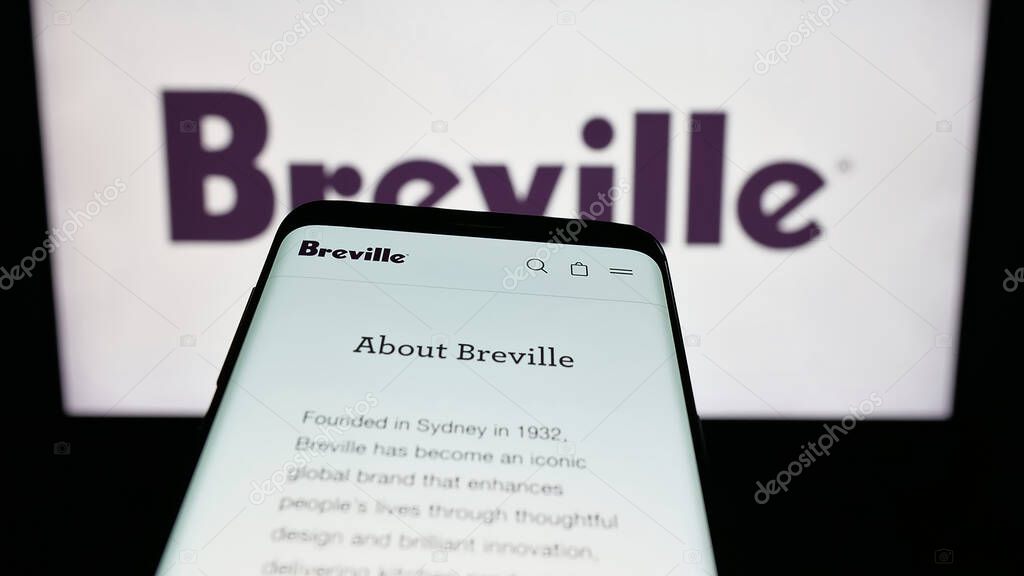 Stuttgart, Germany - 06-12-2025: Mobile phone with website of home appliances company Breville Group Ltd. on screen in front of logo. Focus on top-left of phone display.