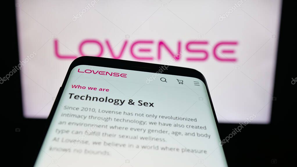 Stuttgart, Germany - 09-25-2025: Mobile phone with website of sex toy company Lovense (Hytto Pte. Ltd.) on screen in front of logo. Focus on top-left of phone display.