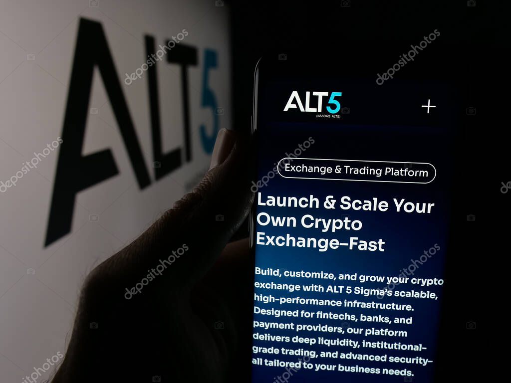 Stuttgart, Germany - 09-27-2025: Person holding smartphone with web page of US financial company ALT5 Sigma Corporation on screen in front of logo. Focus on center of phone display.