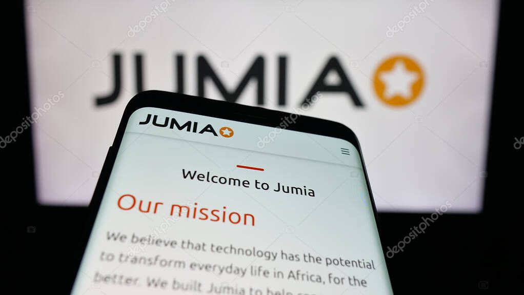 Stuttgart, Germany - 09-29-2025: Mobile phone with website of e-commerce company Jumia Technologies AG on screen in front of logo. Focus on top-left of phone display.