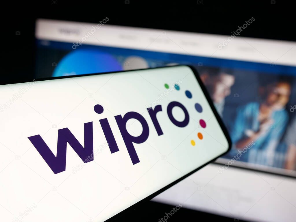 Stuttgart, Germany - 09-29-2025: Smartphone with logo of Indian technology company Wipro Limited on screen in front of website. Focus on center-left of phone display.