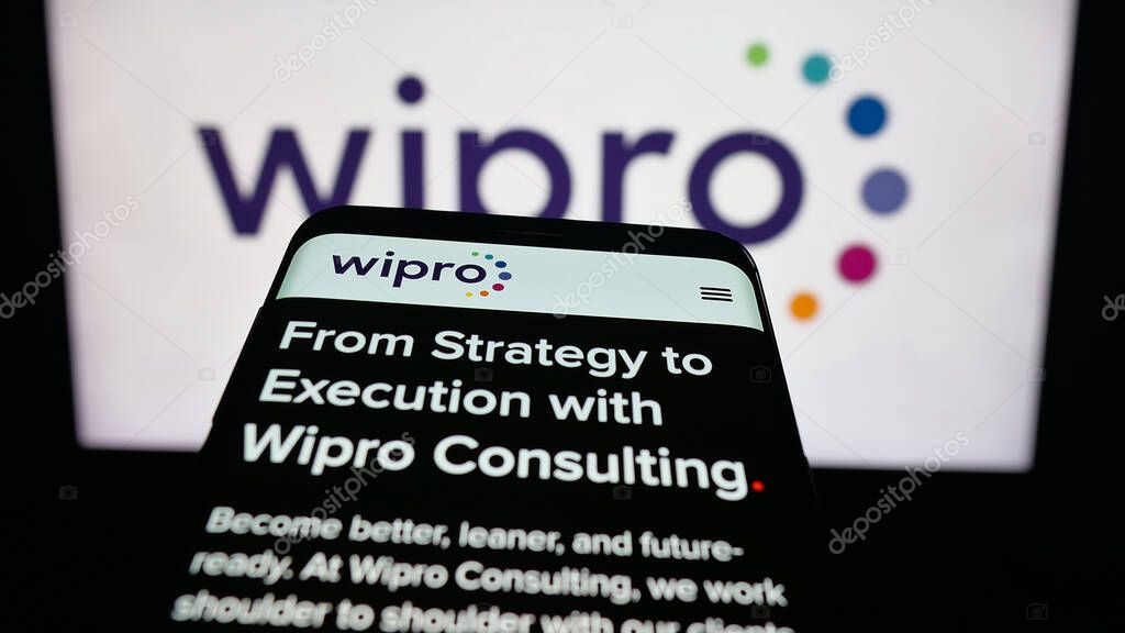 Stuttgart, Germany - 09-29-2025: Mobile phone with website of Indian technology company Wipro Limited on screen in front of logo. Focus on top-left of phone display.