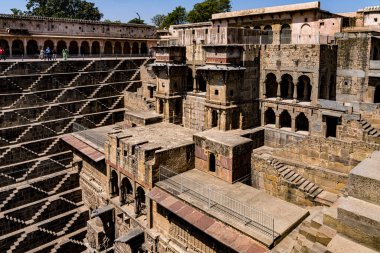 Scenic view of a historic stepwell with intricate stonework, showing the cultural heritage of india clipart