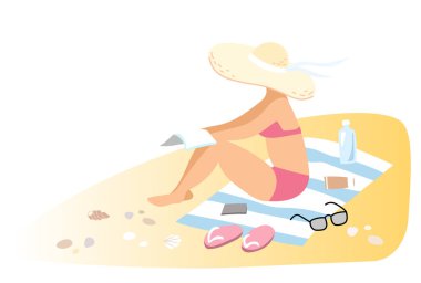 Kadın kumsalda güneşleniyor.