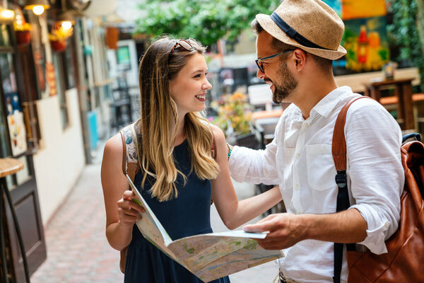 Portrait of happy young couple having fun on vacation. People travel happiness concept.