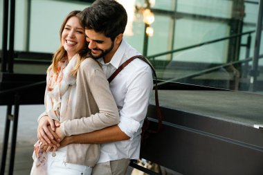 Happy young loving couple hugging and enjoying time together.