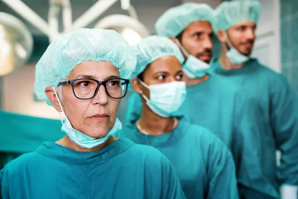 Group of exhausted surgeons at the emergency room as a sign of stress and overwork in hospital