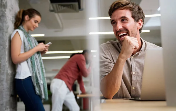 stock image Smiling diverse colleagues gather in boardroom brainstorm discuss financial statistics together, happy multiracial coworkers have fun cooperating working together at office meeting, teamwork concept