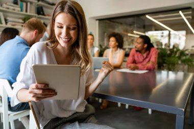 Collaboration and analysis by business people working in office. Successful business women together in corporate office.