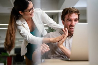 Team of multiethnic creative marketing experts brainstorming during working on advertising strategy for company sharing ideas on conference using technology and wireless connection