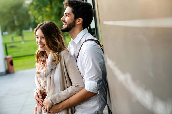 Happy young loving couple hugging and enjoying time together.