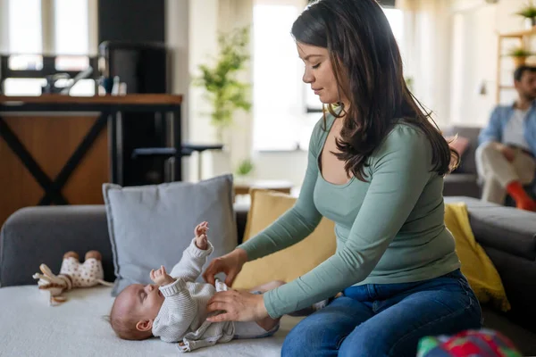 Smiling Young Mother Has Fun Little Baby While Changing His — Stock Photo, Image