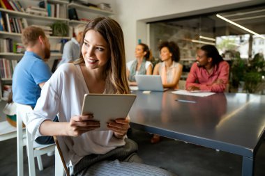 Collaboration and analysis by business people working in office. Successful business women together in corporate office.