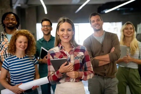 stock image Group of young multi-ethnic startup business team collaborating on project in modern office. Young successful start-up entrepreneurs working as a team together.