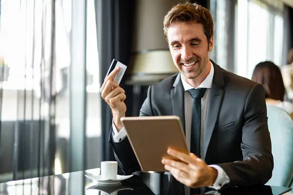 Successful Handsome Business Man Holding Credit Card Using Digital Tablet — Stock Photo, Image
