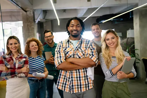 stock image Group of young multi-ethnic startup business team collaborating on project in modern office. Young successful start-up entrepreneurs working as a team together.