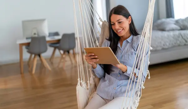 Stock image Successful positive caucasian business woman, executive, recruitment, product manager, work from home, looks at computer screen, satisfied with the result