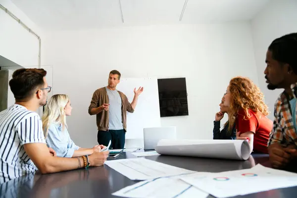 stock image Business solutions, technology, success and strategy concept. Colleagues working and brainstorming in office