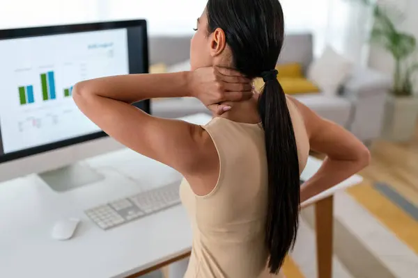 stock image Tired woman massaging rubbing stiff sore neck tensed muscles fatigued from computer work in incorrect posture feeling hurt joint shoulder back pain ache