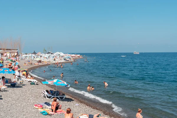 stock image Batumi, Georgia - 30 August, 2022: People relax on the beach in Batumi. Tourism