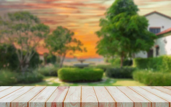 perspective wooden board bar over blurred lovely countryside English style garden