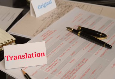 translation paperwork on table in office clipart