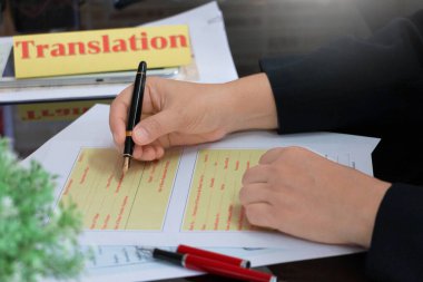 translation paperwork on table in office for service  clipart