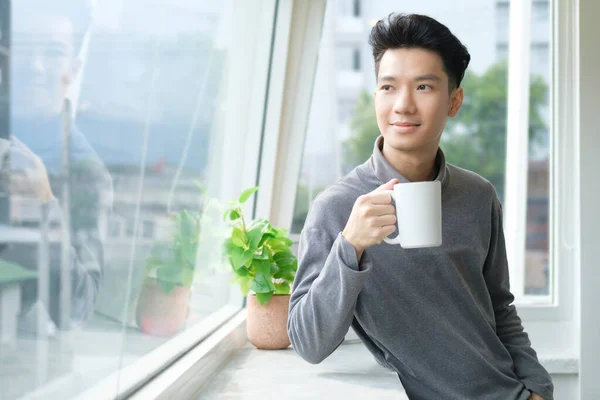 Thoughtful Young Businessman Drinking Coffee Looking Office Window — Stock Photo, Image