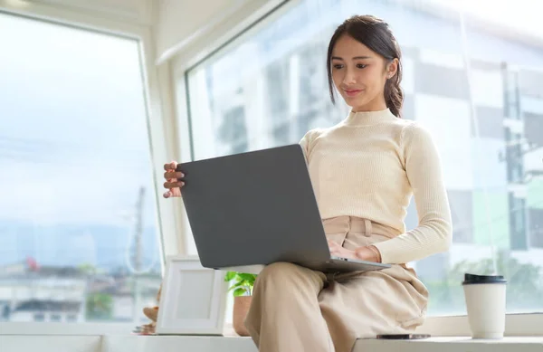 Stylish Business Woman Using Laptop While Sitting Large Window Overlooking — Stok fotoğraf
