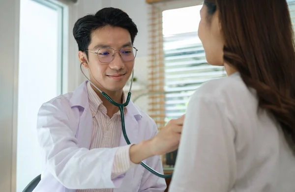 Caring Doctor Using Stethoscope Listening Patient Heart Checkup Examination Clinic —  Fotos de Stock