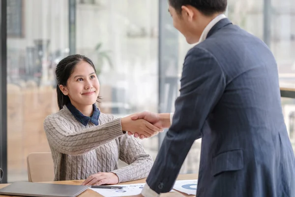 stock image Friendly human resources  manager greeting applicant before job interview process.