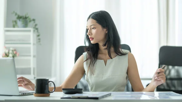Millennial Asian Businesswoman Using Laptop Working Financial Document Office — ストック写真