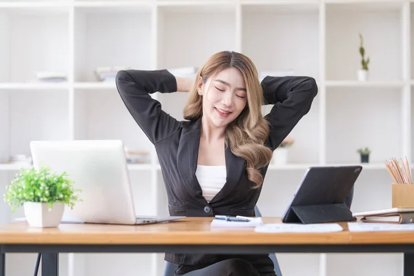 Satisfied Asian Young Woman Relaxing Her Workplace Looking Window Office — 스톡 사진