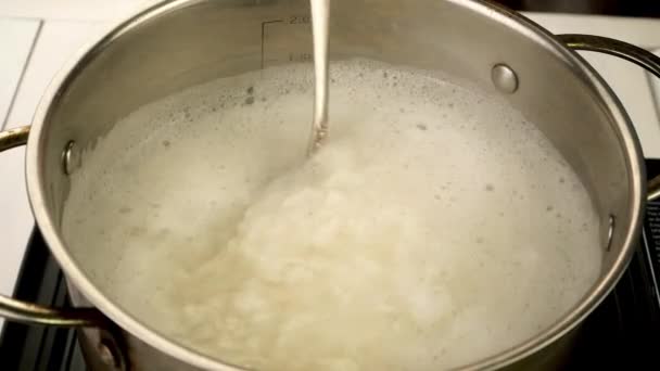 Boiling Rice Metal Pot Stirred Spoon Prepare Nutritious Side Dish — Vídeo de stock