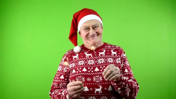 모자와 Xmas 스웨터에 재미와 스파클러와 재미와 즐거운 크리스마스의 성숙한 스크린 — 비디오