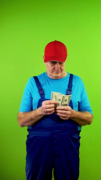 Senior Repairman Overalls Satisfied Counting Dollars Puts Pocket Mature Worker — Stock Video