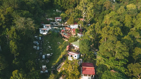 stock image Perak, Malaysia - Oct 19, 2022 Aerial view of the Kuak Hill Resort in Lenggong during sunrise.