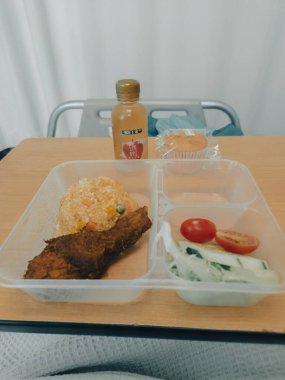 Kajang, Malaysia - June 17, 2022 KPJ Kajang hospital Food delivered to a patient in hospital bed, focus on the meal.