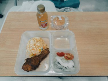 Kajang, Malaysia - June 17, 2022 KPJ Kajang hospital Food delivered to a patient in hospital bed, focus on the meal.