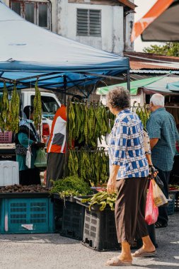 PERAK, MALAYSIA - Oct 18, 2022: A stall selling all kinds of traditonal food at the morning market in Karai, Kuala Kangsar.