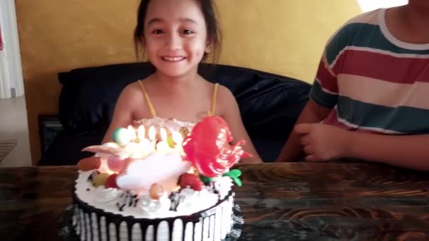 Young Girl Blows Out Candles She Celebrates Her Fifth Birthday — Stockvideo