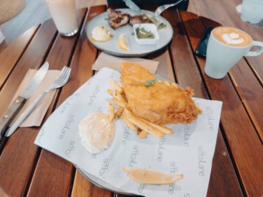 Kajang, Malaysia - June 14, 2022 Fish and chips on the plate at the Koffie Lake cafe.