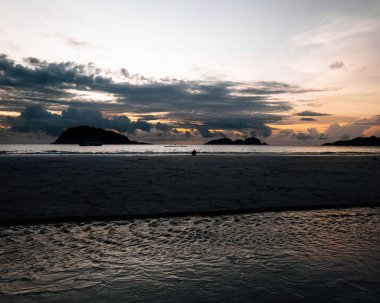 Golden sunrise by the beach.