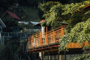 Wooden balcony on the terrace of the hill during sunrise.