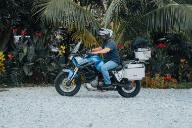 Sekinchan, Malaysia - Oct 5, 2022 Adventure motorcycle traveler on the off road.