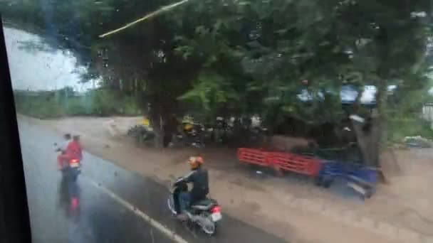 Countryside Cambodia View Out Bus Window Motorbikes Cloudy Rainy Weather — Αρχείο Βίντεο