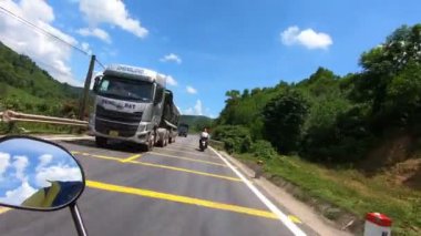 POV Sunny road motorbike riding Vietnam, mirror, green scenery. Roadtrip. High quality FullHD footage