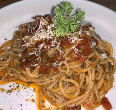 Delicious Spaghetti Bolognese, Pasta with meat, tuna, and tomato sauce and vegetables american italian cuisine with tomato sauce and vegetables