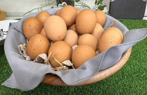 basket of chicken eggs on a table over farm in the countryside, healthy organic eggs, farm produce good for your cooking blog